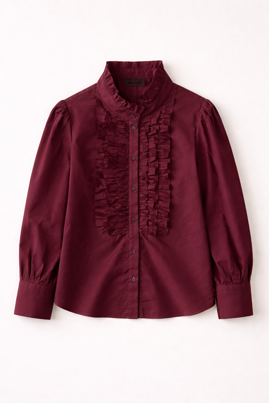 Maroon blouse with ruffled details on a white background
